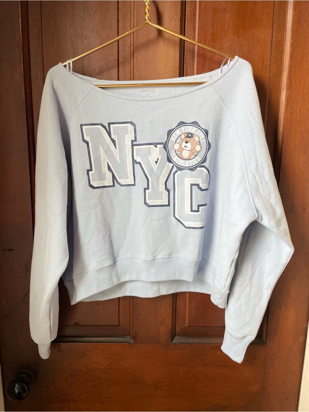 Hollister women's medium light blue wide neck sweatshirt